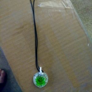 Green glass necklace with leaf design